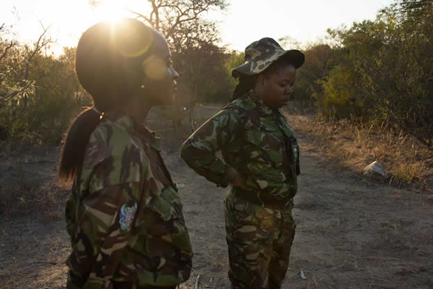photo of two women in military camouflage outdoors