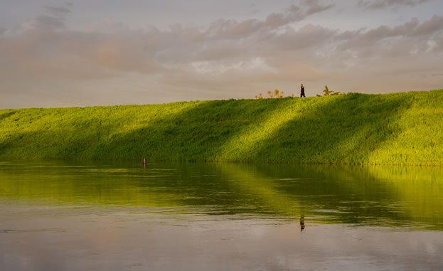 photo of a levee by a river